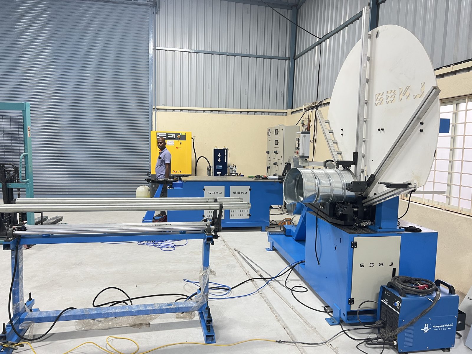 Spiral tubeformer line with run-out table installed in an Indian factory