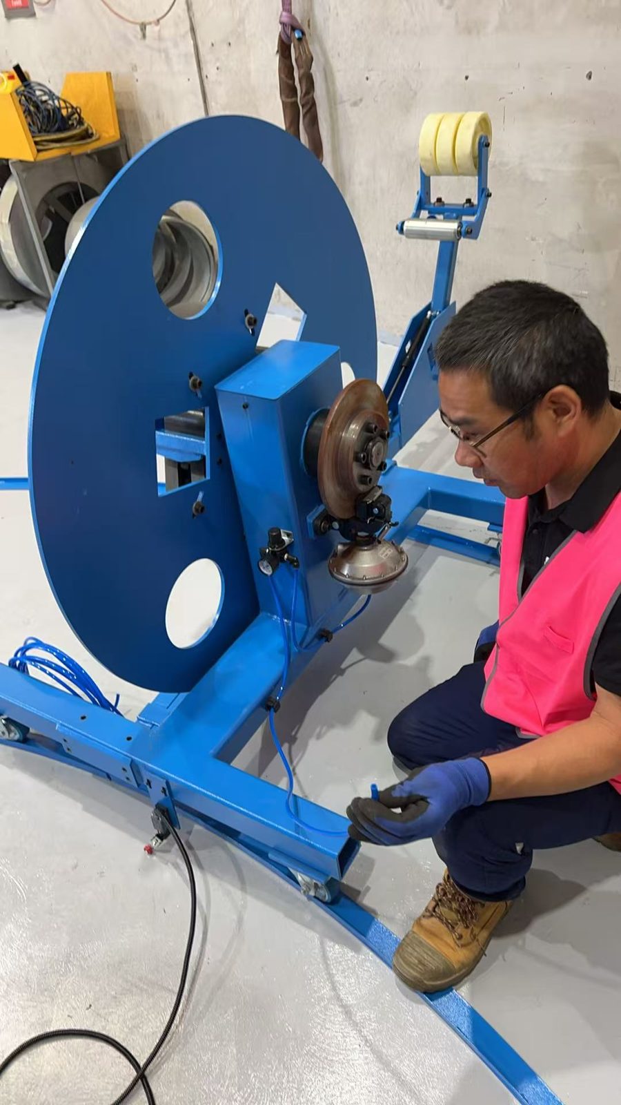 Taokron engineer setting up the decoiler for the SBTF-1602 at Kavanagh Industries